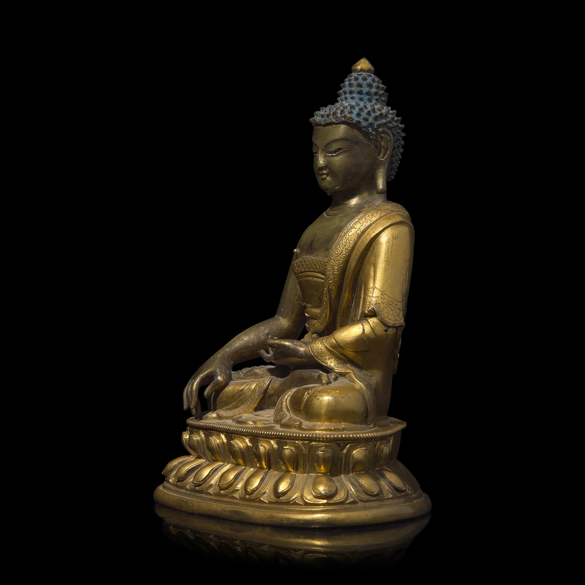 A Sino-Tibetan Gilt Bronze Figure of a Buddha, Qing Dynasty, Probably 18th Century 或十八世紀 鎏金銅佛坐像