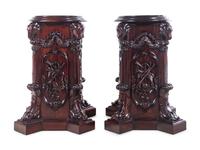 A Pair of George III Style Carved Mahogany Pedestals