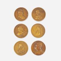 A group of six bronze medallions depicting American presidents, early 20th century