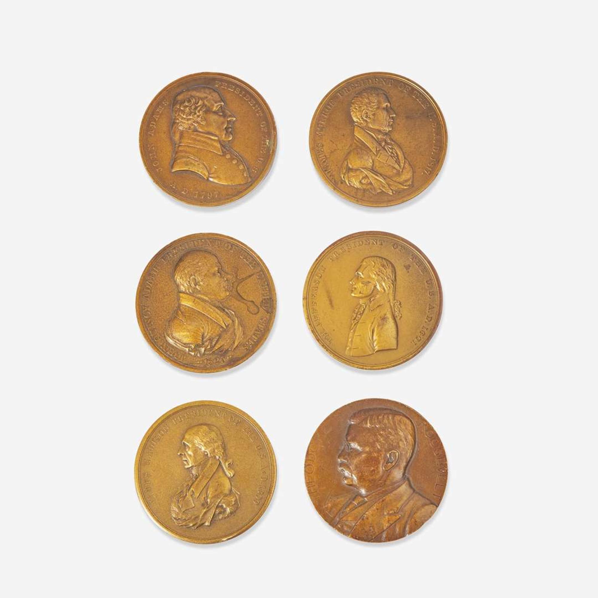 A group of six bronze medallions depicting American presidents, early 20th century