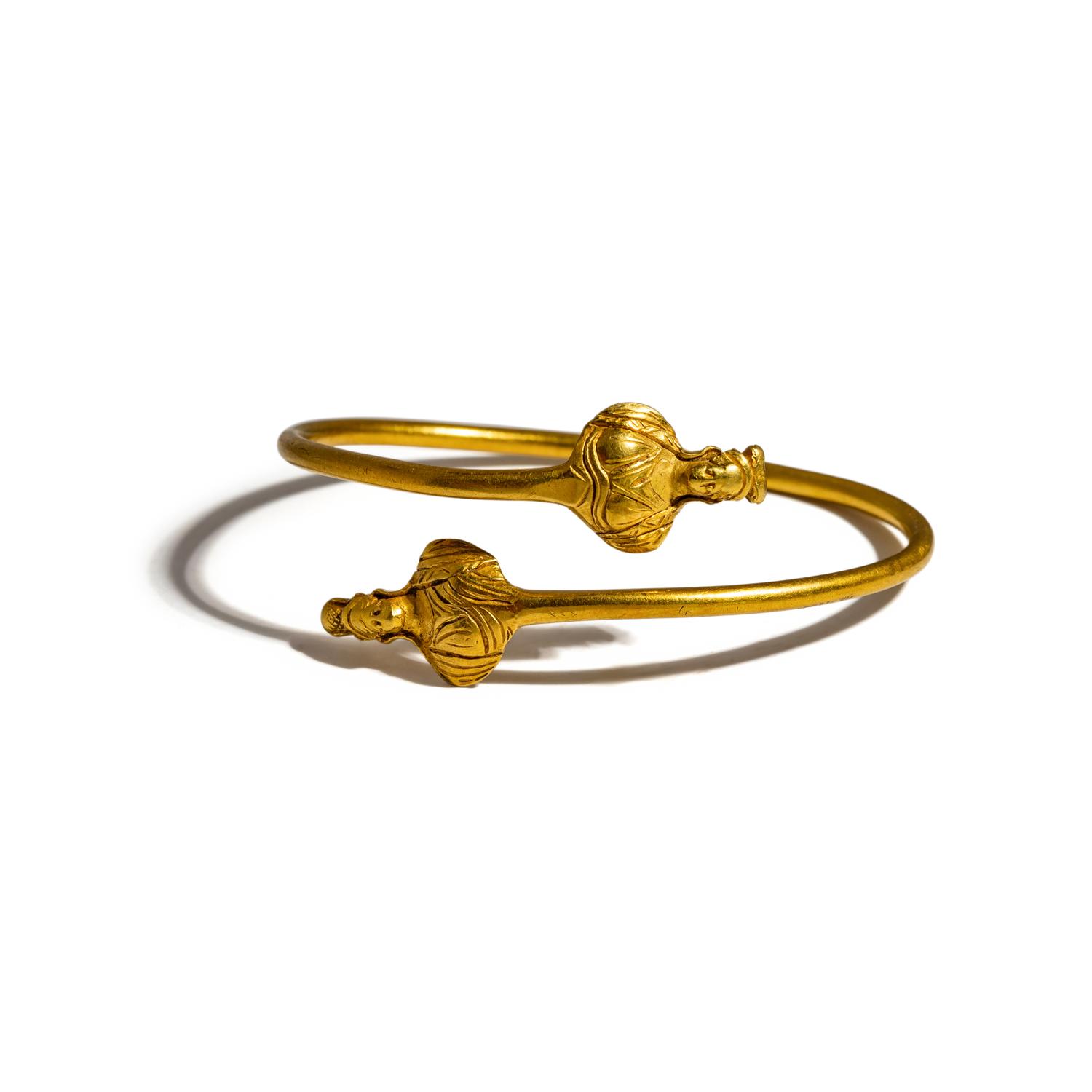 An Egyptian Gold Bracelet with Terminal Busts of the Goddess Isis