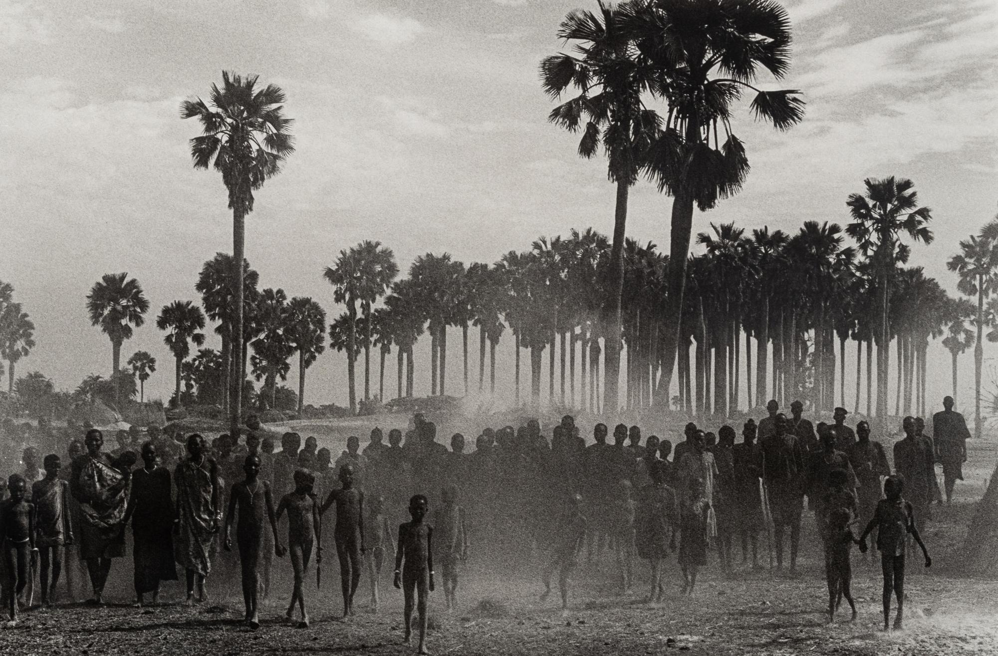 Sebastião Salgado (born 1944) The population of the cattle camp of Kenya walk toward the polio vaccinators as soon as they arrive, Maper Payem area, Rumbek District, Southern Sudan, 2001