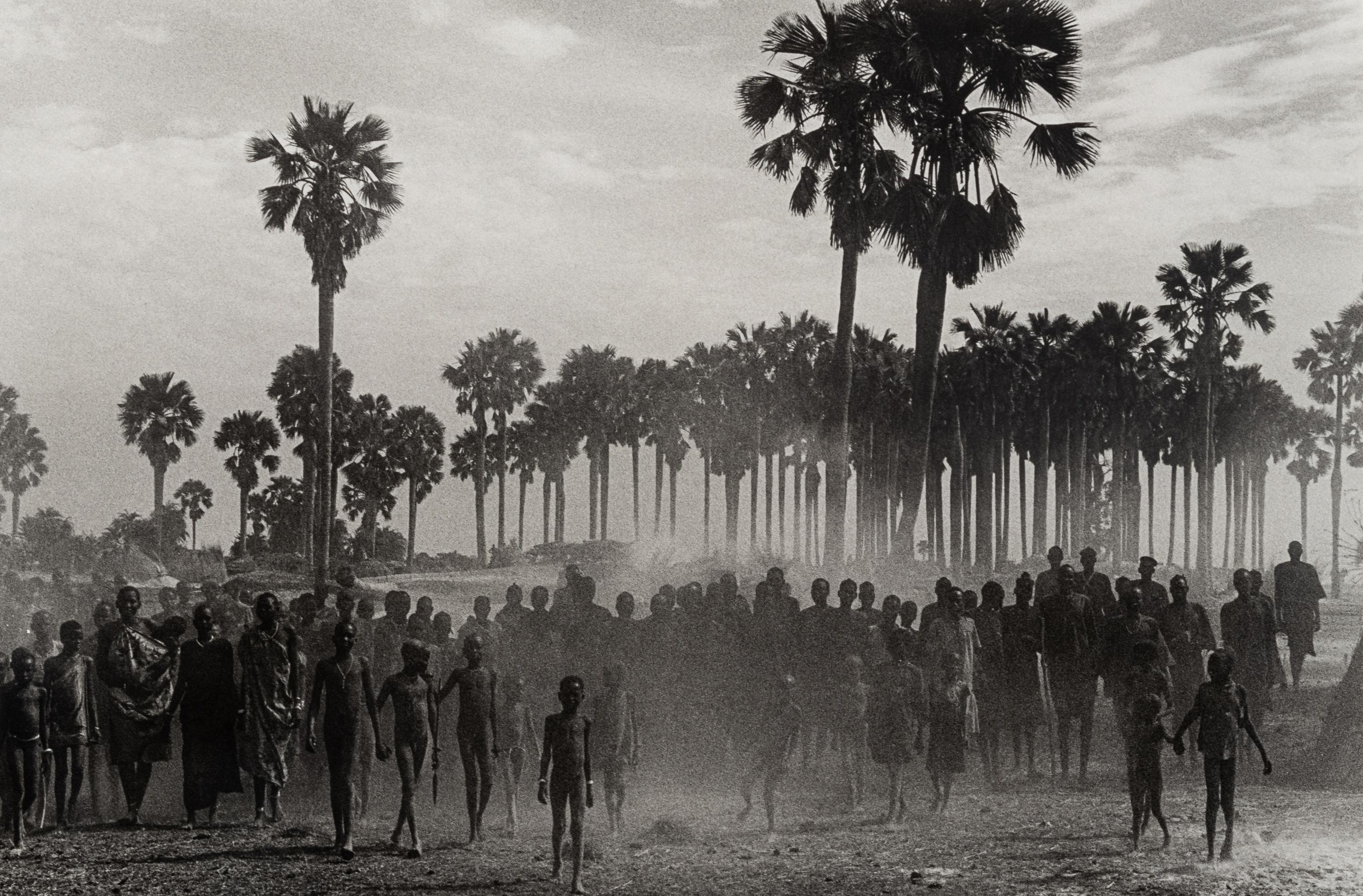 Sebastião Salgado (born 1944) The population of the cattle camp of Kenya walk toward the polio vaccinators as soon as they arrive, Maper Payem area, Rumbek District, Southern Sudan, 2001