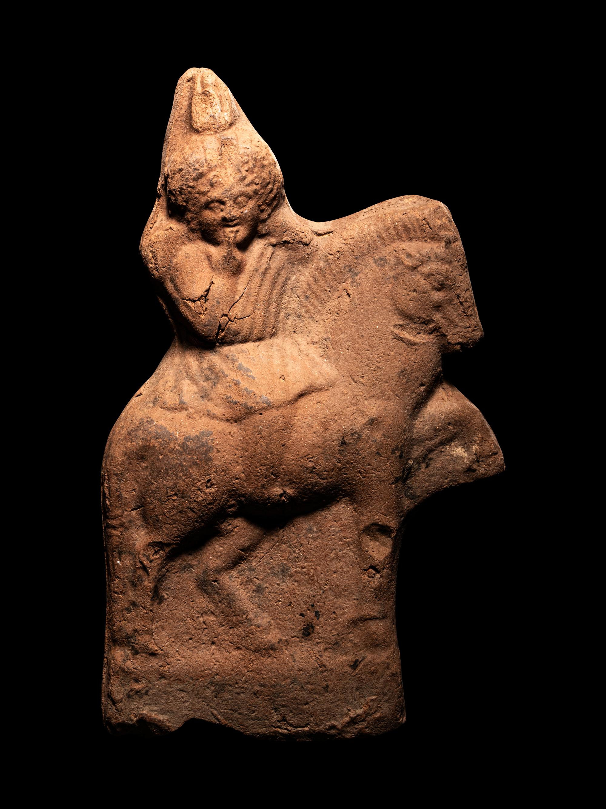A Greek Terracotta with Harpocrates Riding a Horse