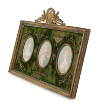Three Napoleonic Portrait Miniatures in a Gilt Bronze Frame