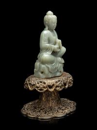 A Chinese Celadon Jade Figure of Seated Guanyin