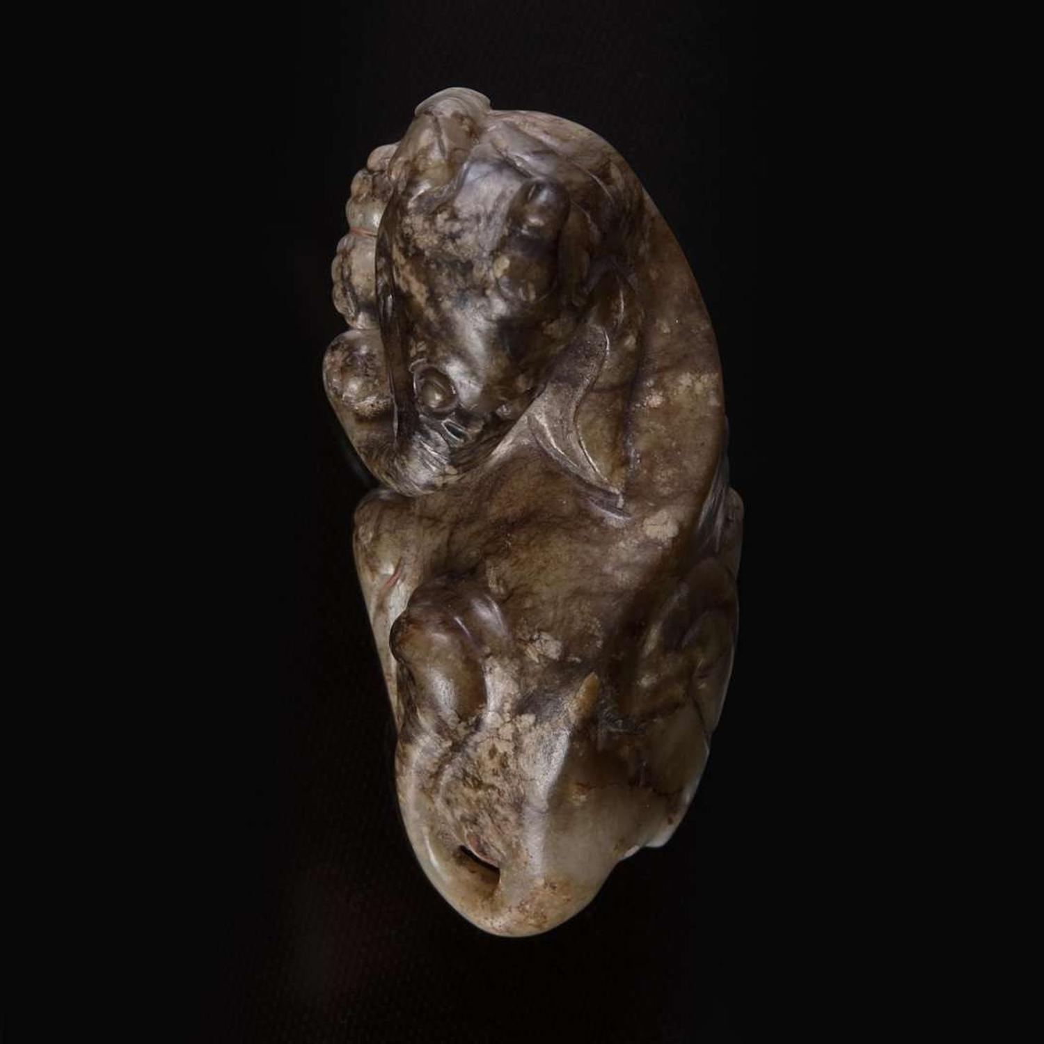 A Chinese brown and beige jade carving of a Baku 玉雕貘 Ming dynasty or earlier ????