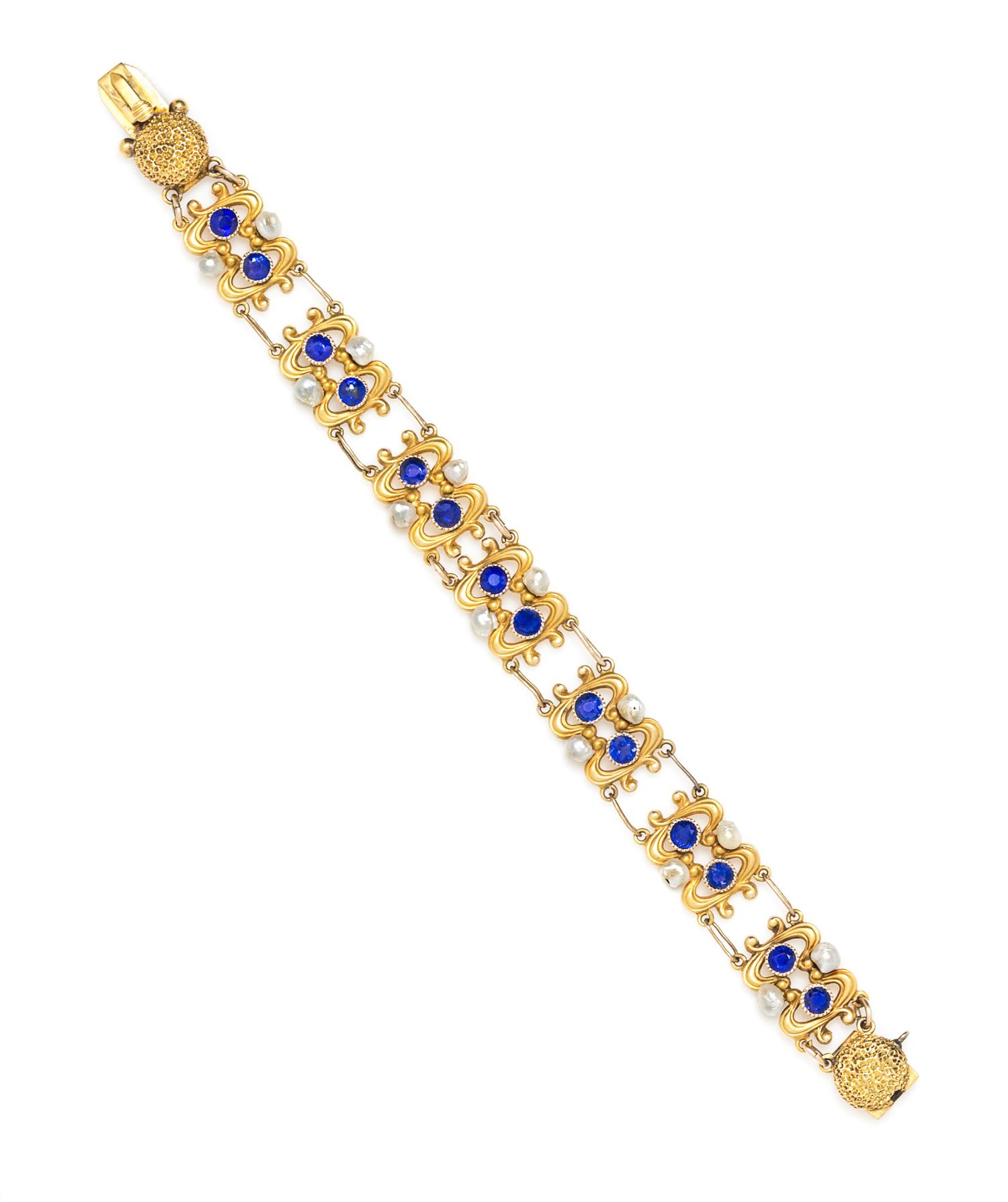 An Art Nouveau Yellow Gold, Sapphire and Pearl Bracelet, 7.50 dwts.