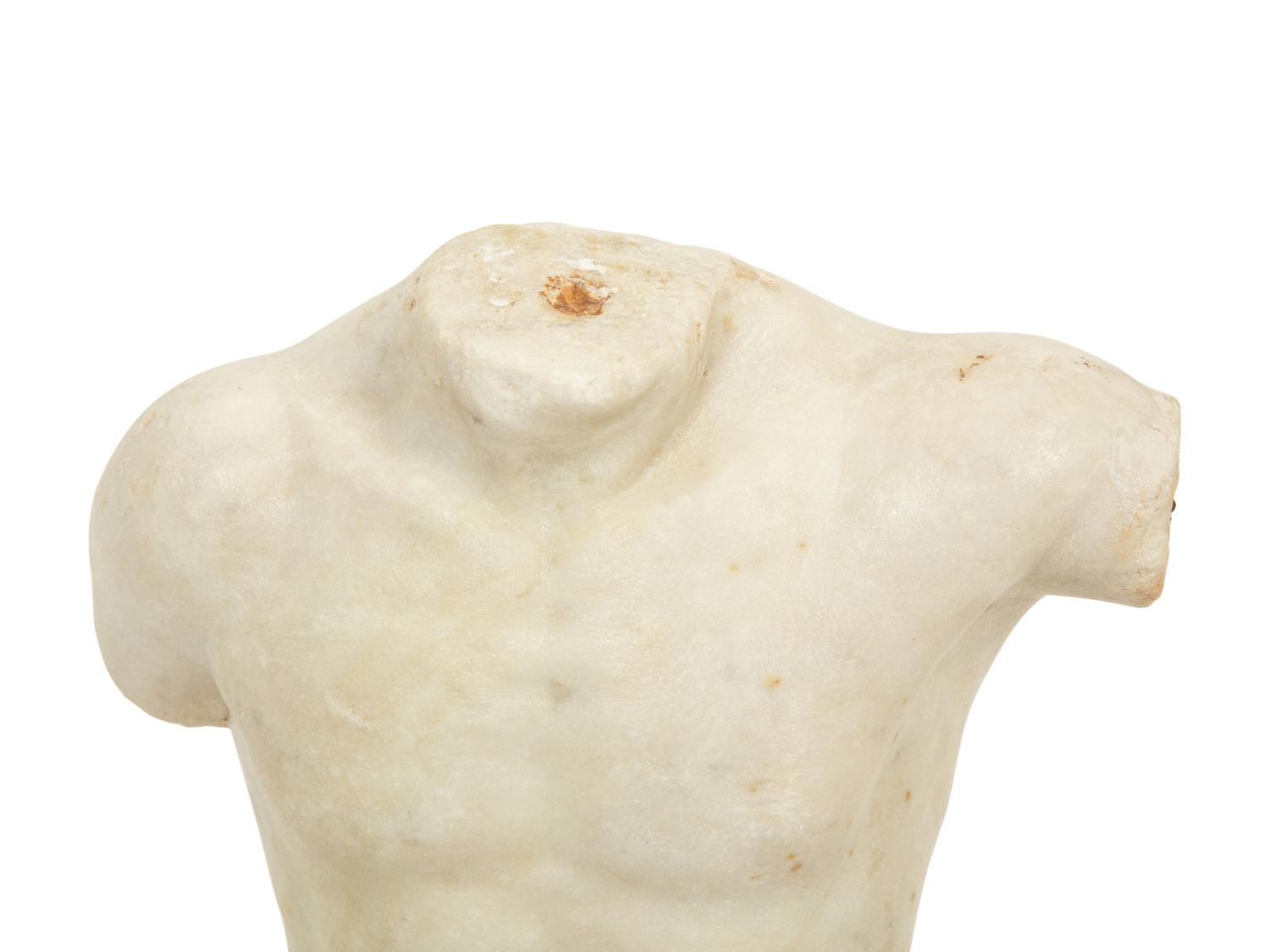 A Continental Carved Marble Male Torso