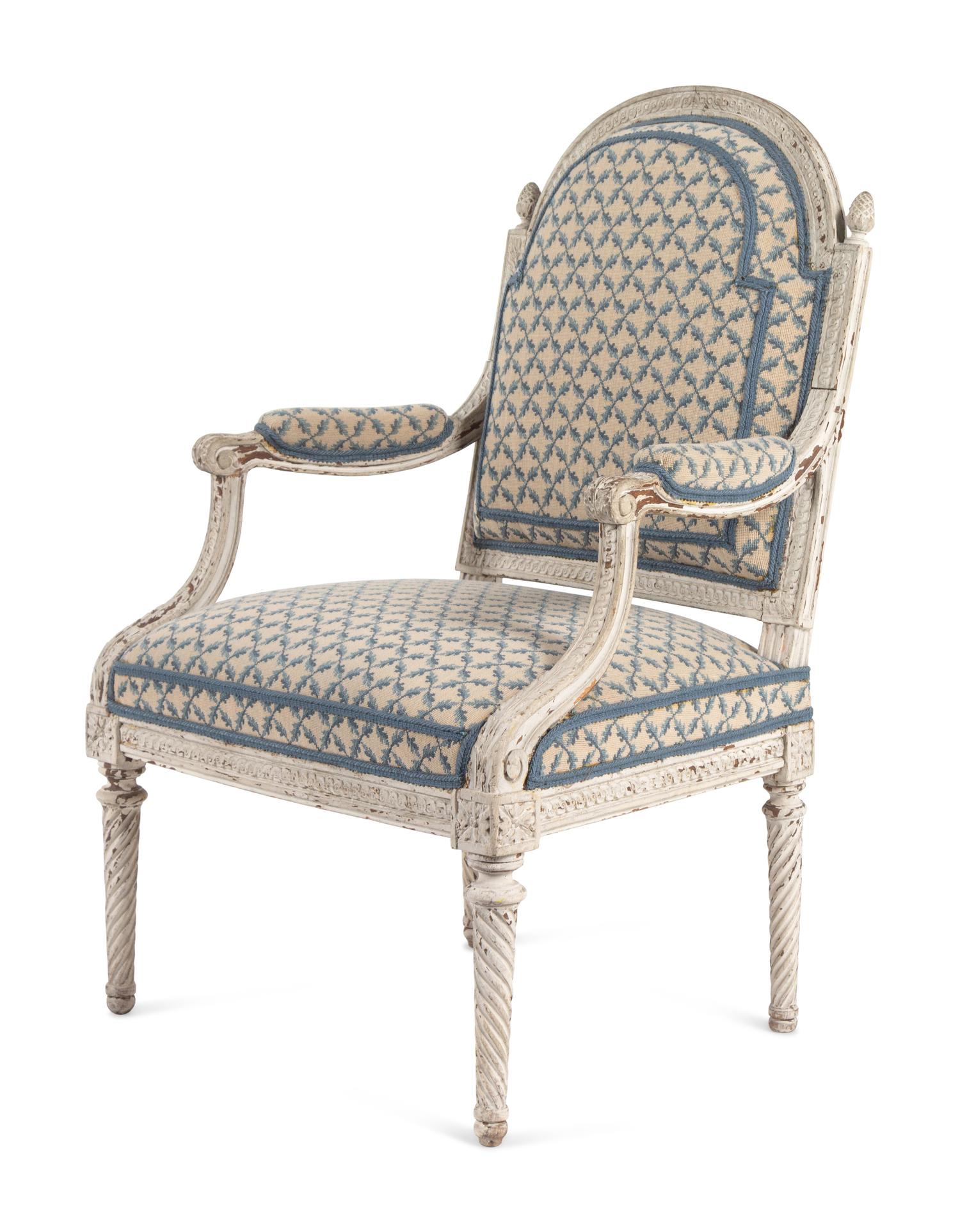 A Pair of Louis XVI Provincial White-Painted Fauteuils