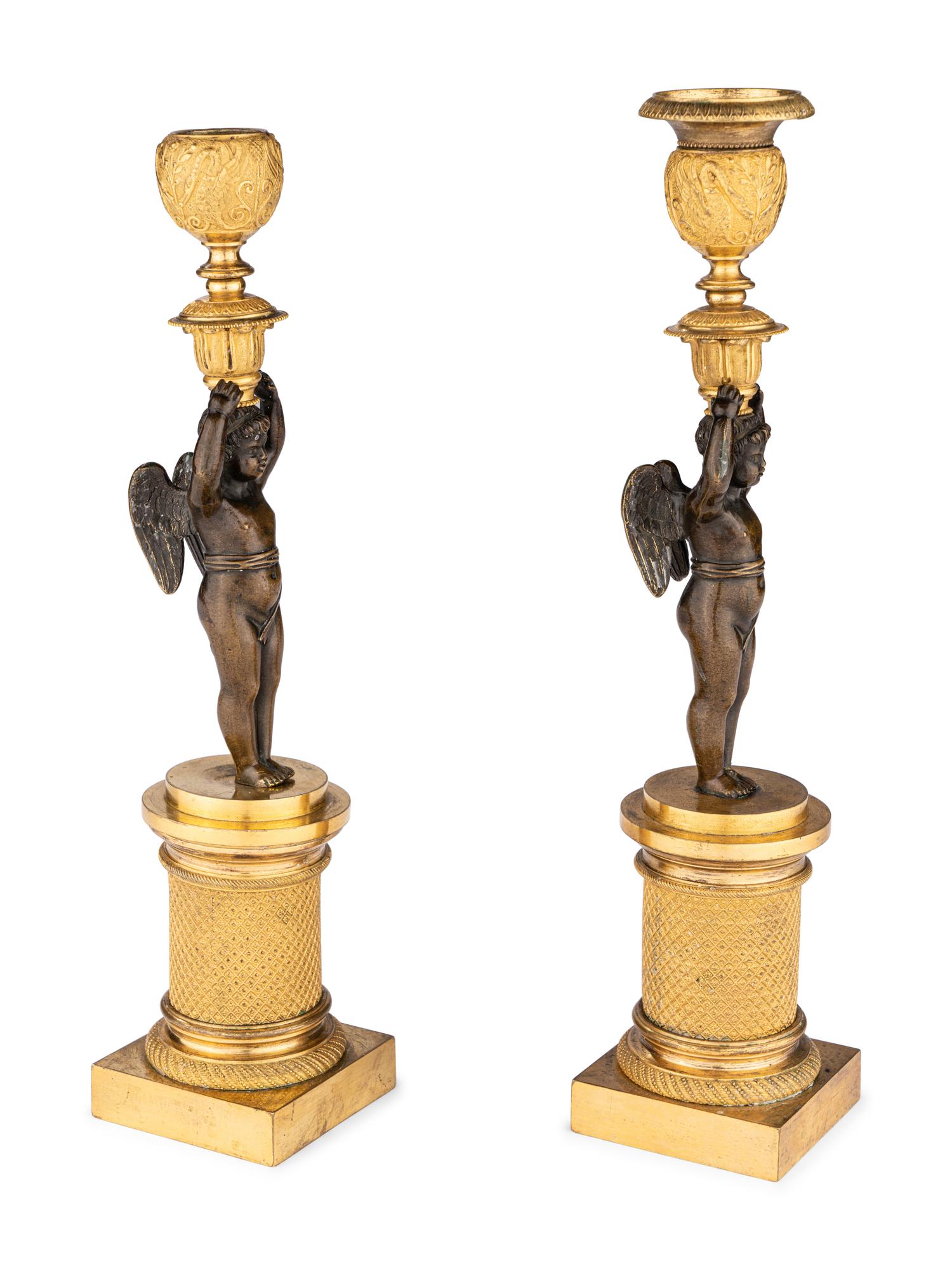 A Pair of Restauration Ormolu and Patinated Bronze Figural Candlesticks