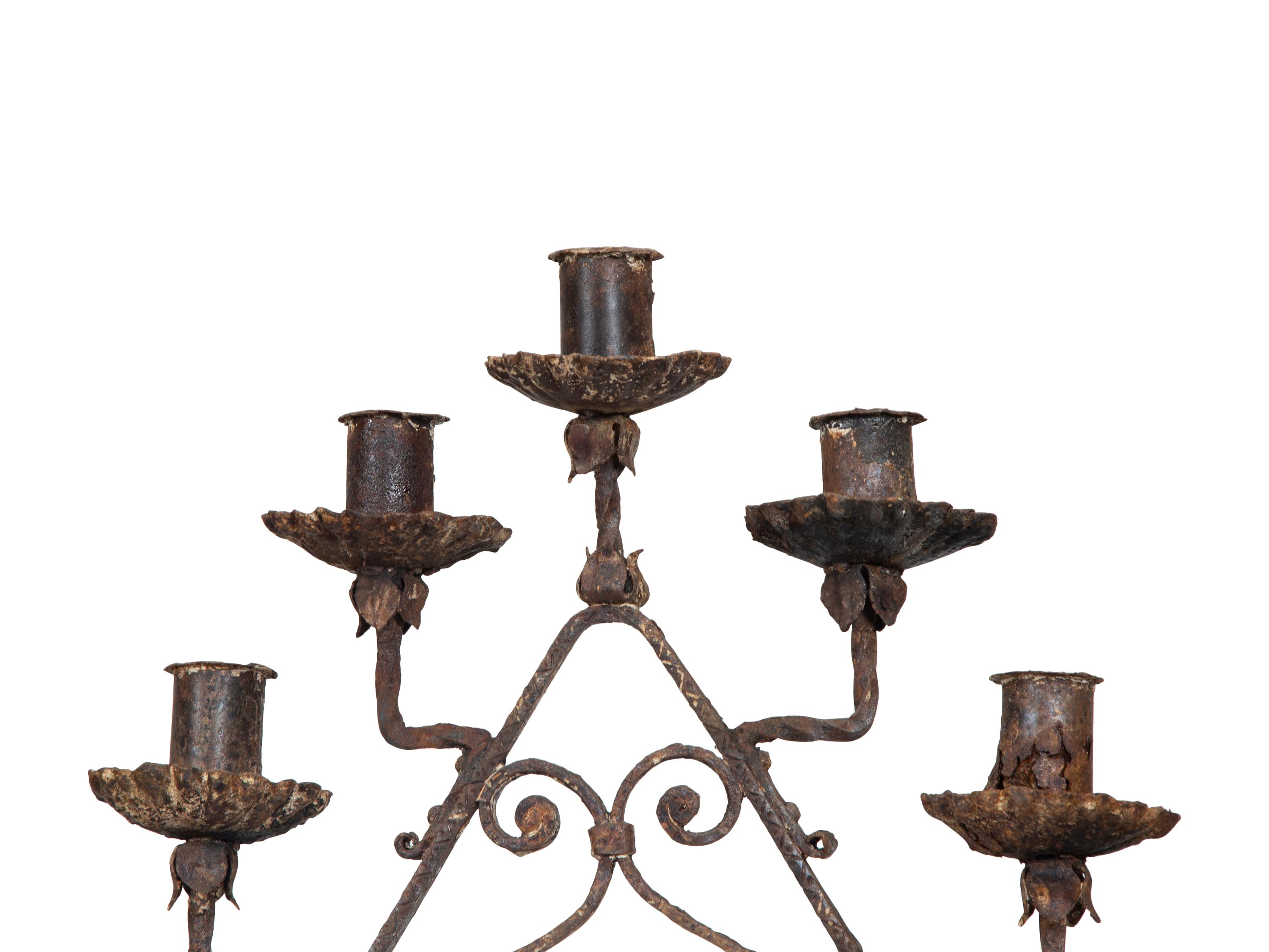 A Pair of Mizner Wrought Iron Seven-Light Floor Candelabra