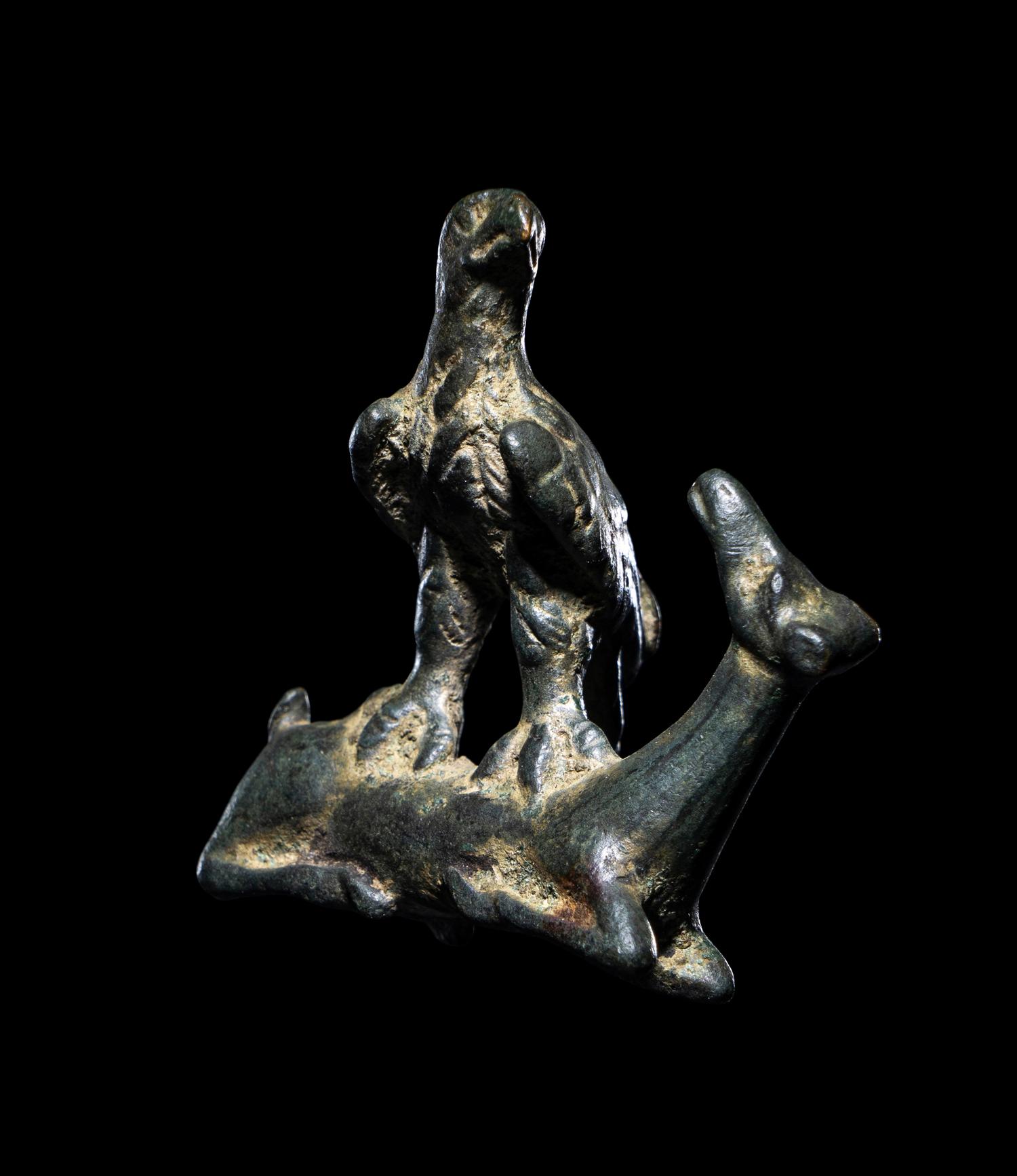 A Roman Bronze Eagle Grasping a Deer