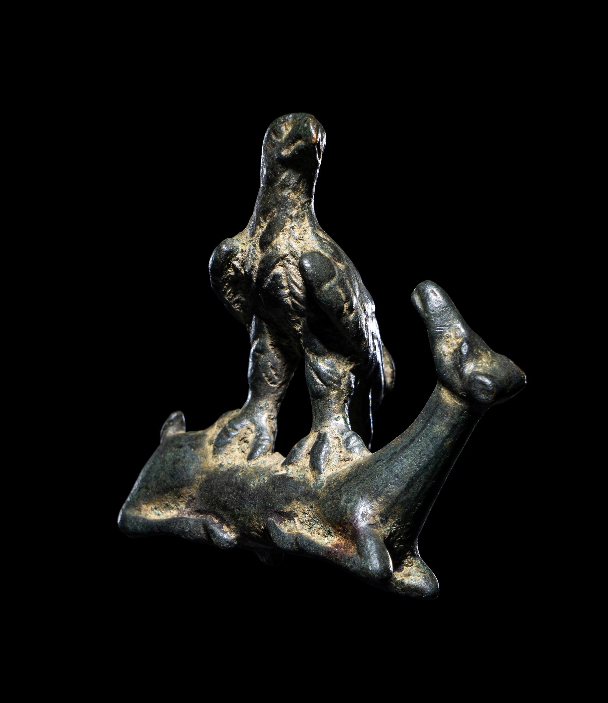 A Roman Bronze Eagle Grasping a Deer