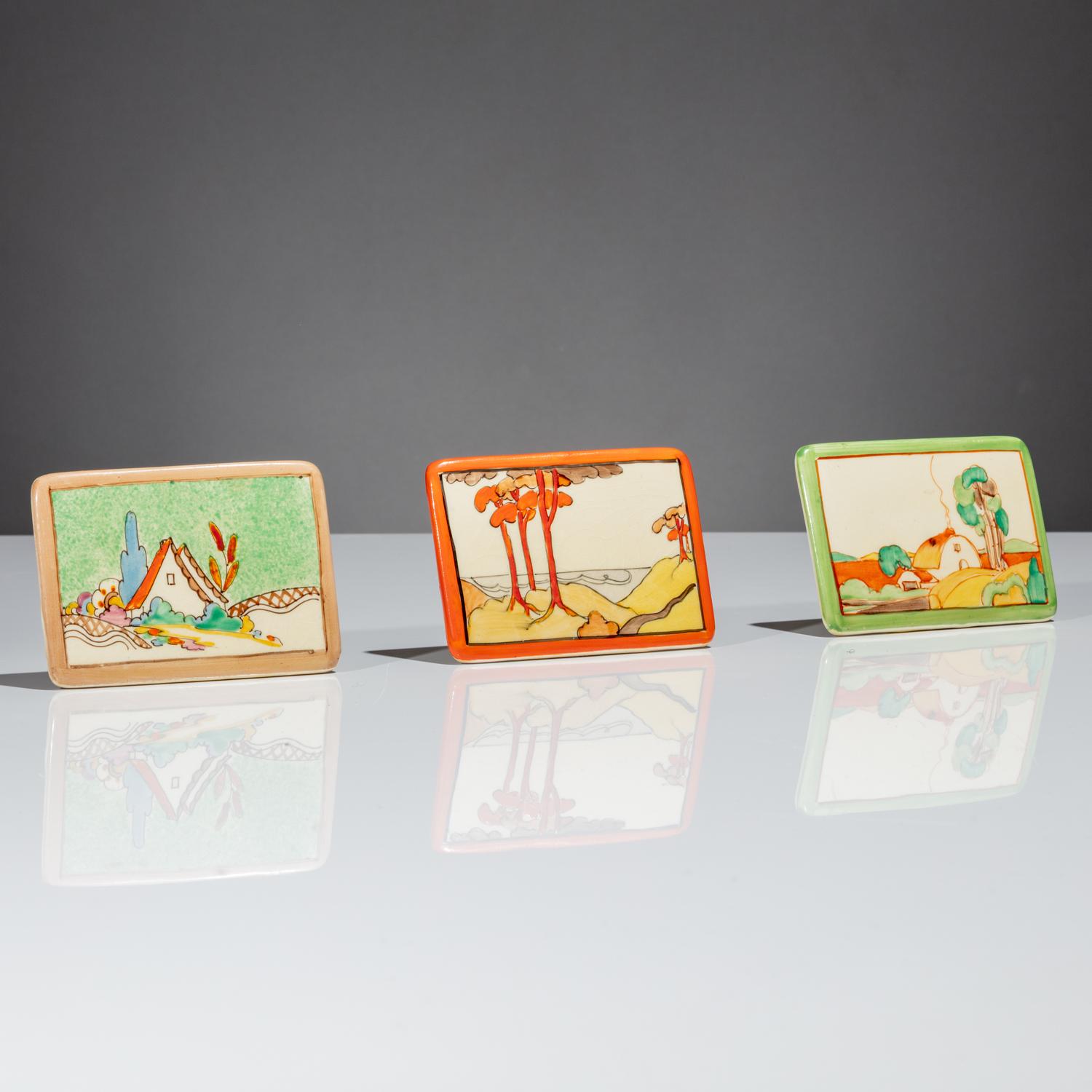 Clarice Cliff (English, 1899–1972) — Three Advertising Plaques, Chalet, Coral Firs and Brookfields patterns