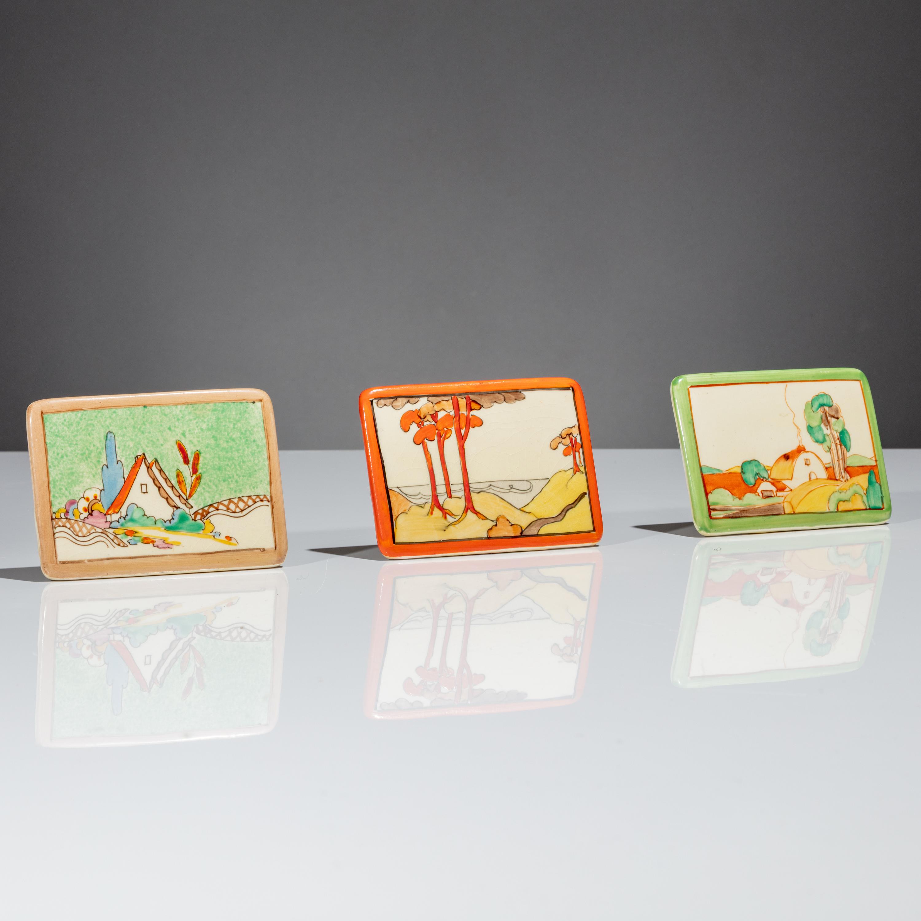 Clarice Cliff (English, 1899–1972) — Three Advertising Plaques, Chalet, Coral Firs and Brookfields patterns