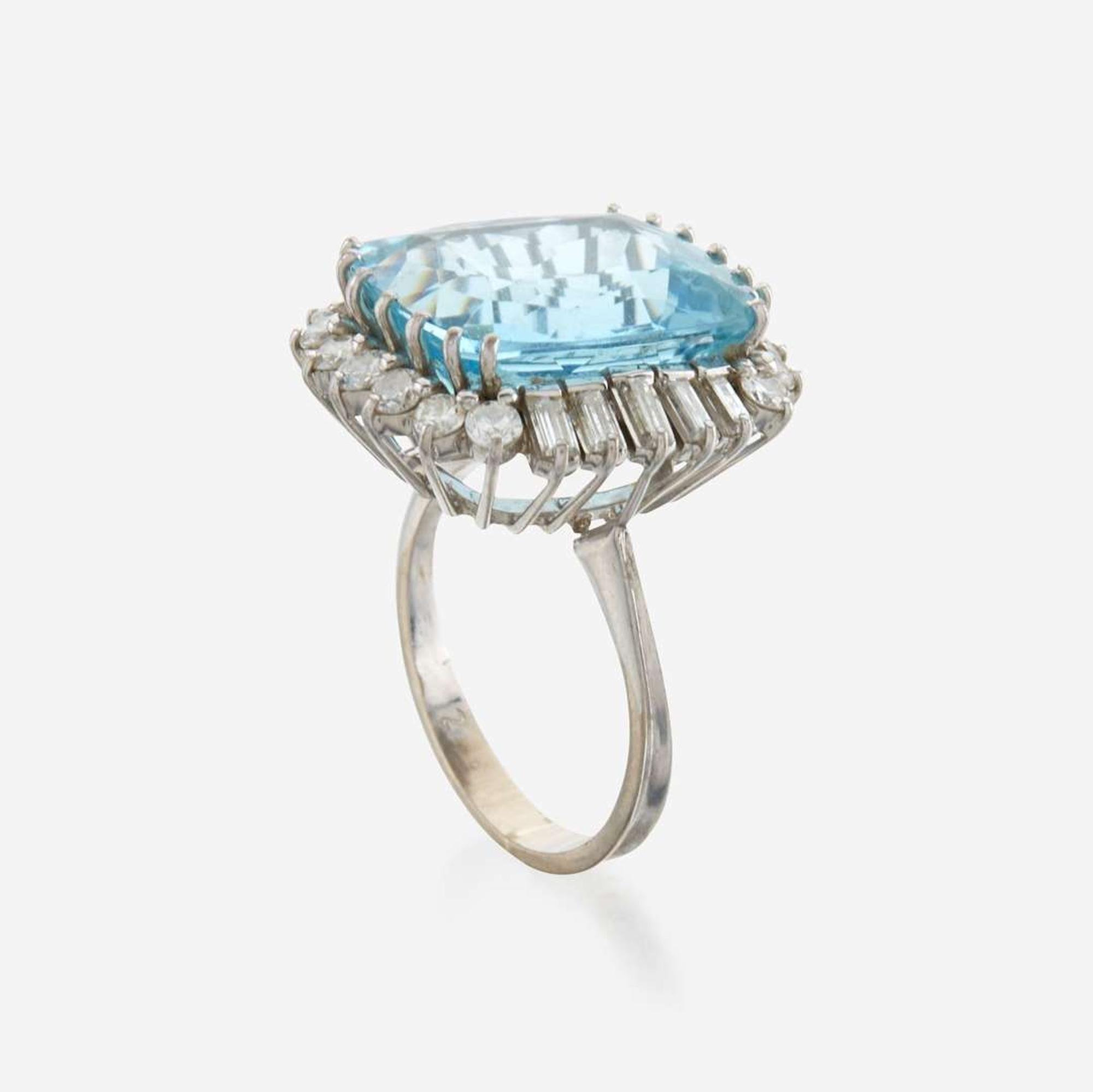An aquamarine, diamond, and white gold ring