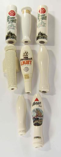 A Collection of Eighteen Haeger Pottery Beer Taps Height of tallest 10 3/4 inches.
