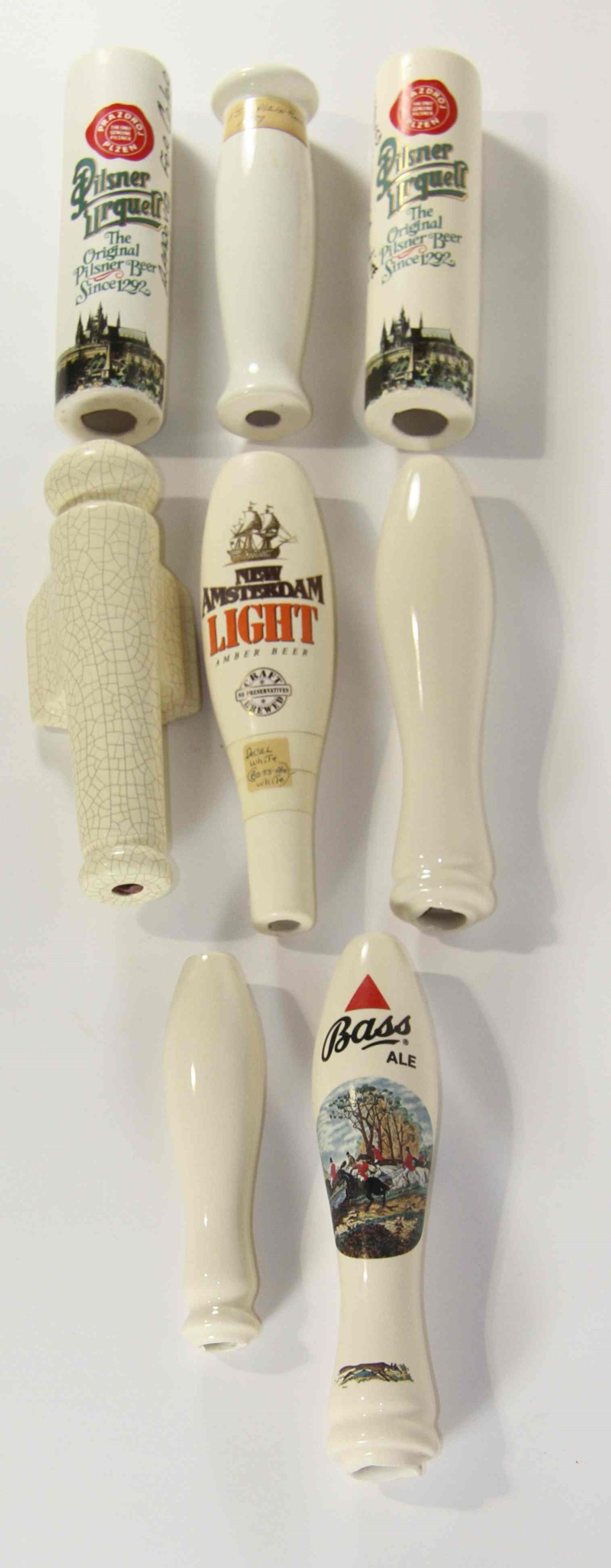 A Collection of Eighteen Haeger Pottery Beer Taps Height of tallest 10 3/4 inches.
