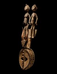 A Bamana Wood Horned Mask with Figures