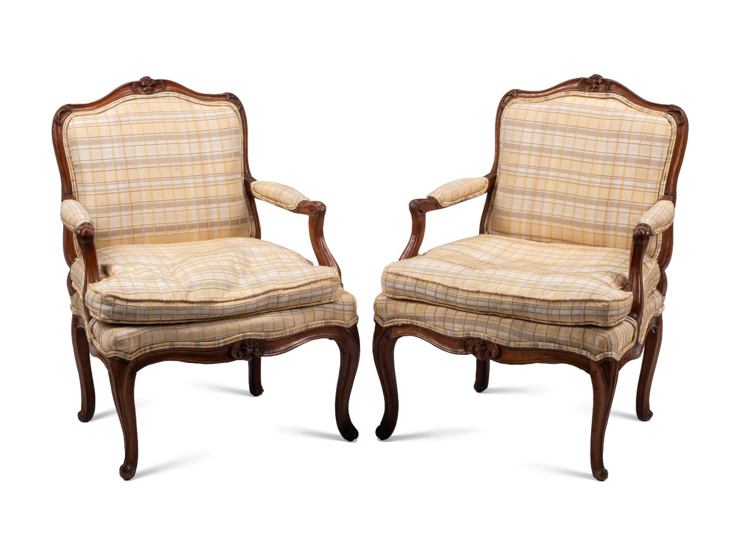 A Pair of Louis XV Provincial Walnut Fauteuils