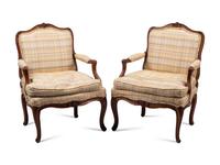 A Pair of Louis XV Provincial Walnut Fauteuils
