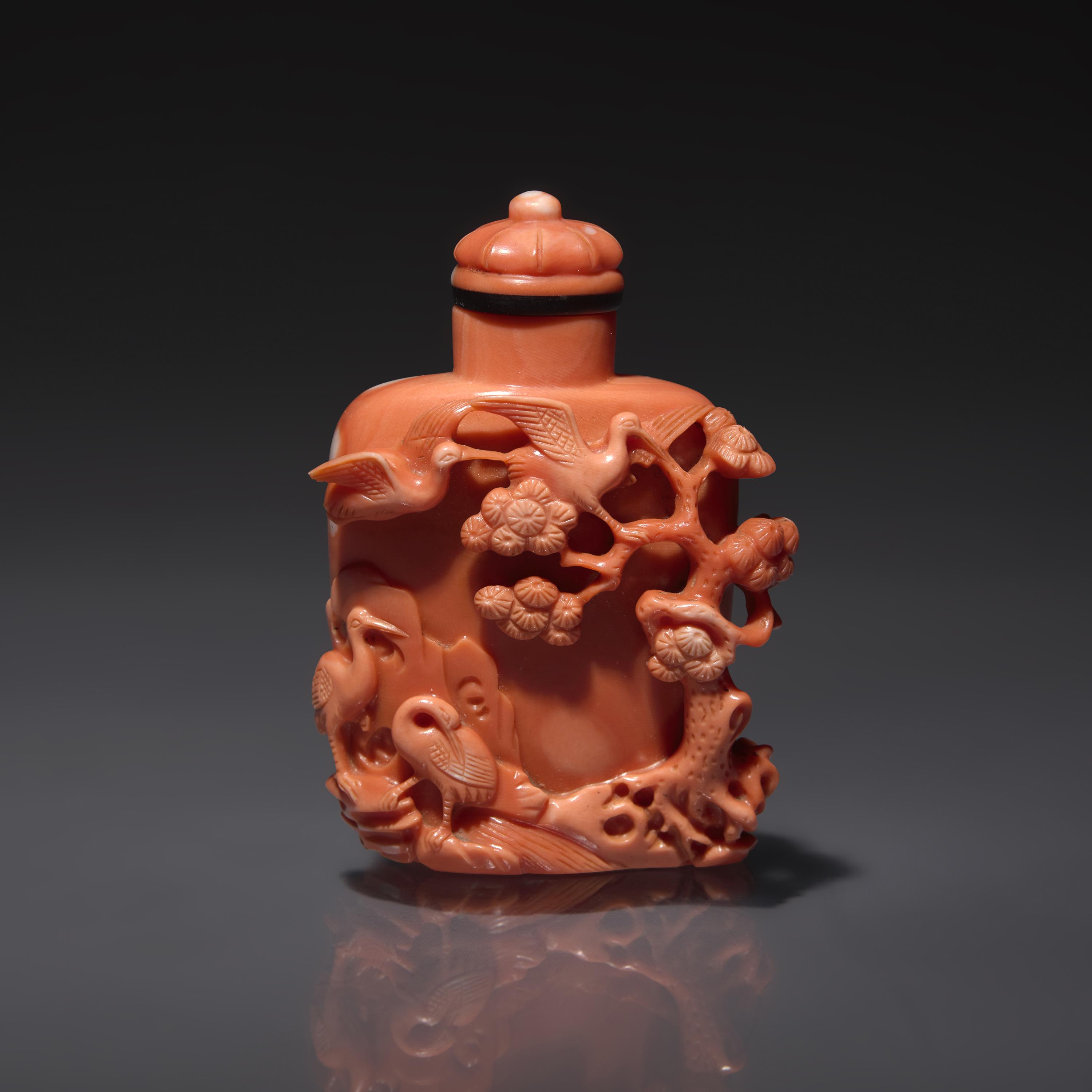 A Finely-Carved Coral Snuff Bottle, Guangxu Period — 清光緒 珊瑚雕松鶴圖鼻煙壺