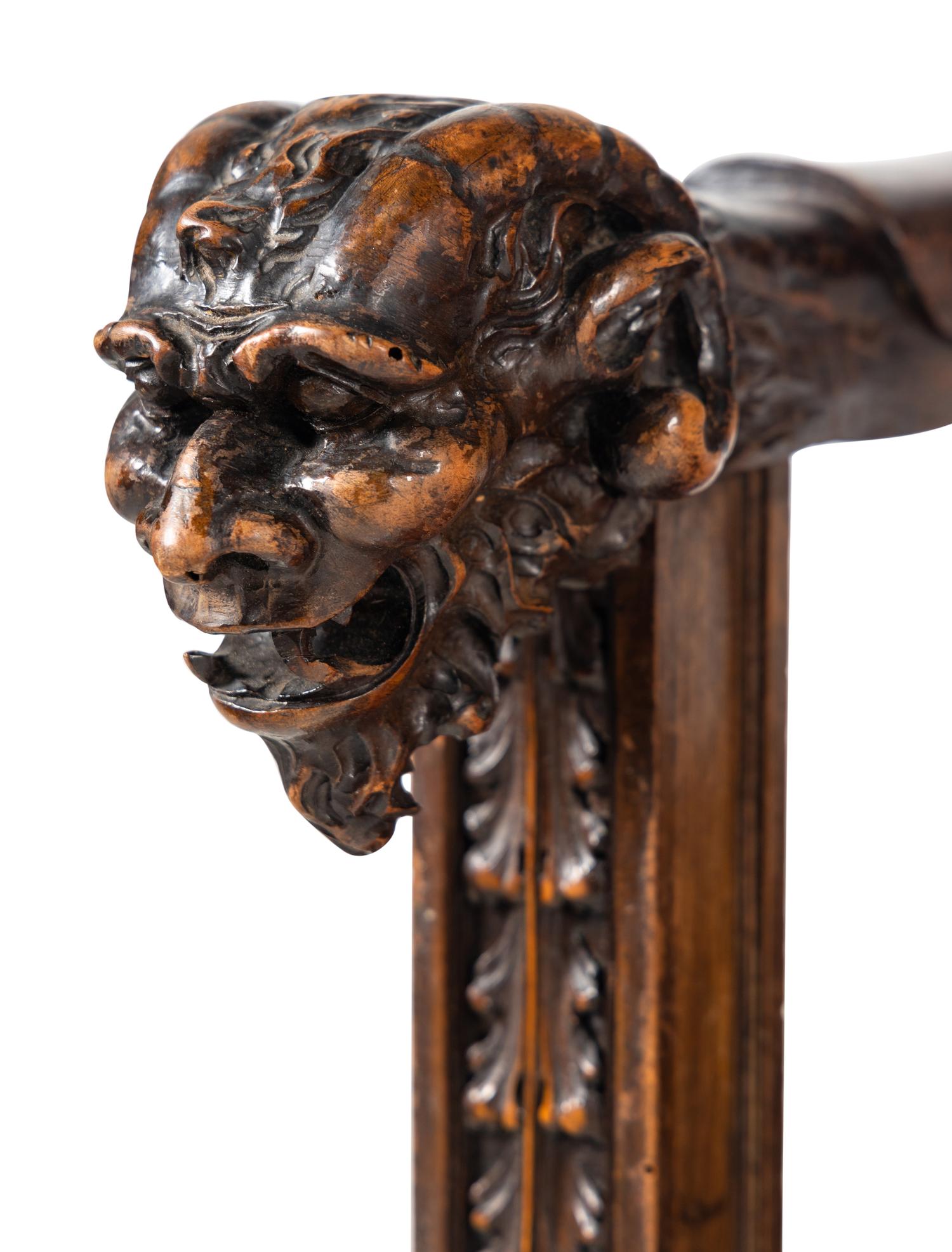 A Pair of Italian Renaissance Revival Carved Walnut Armchairs