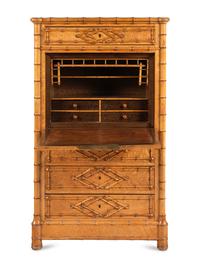 A Victorian Faux Bamboo-Carved Birdseye Maple Bureau Chest