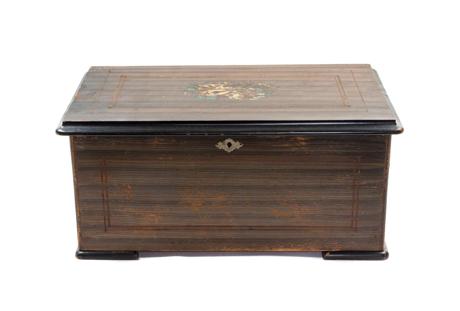 A Swiss Cylinder Music Box, Height 8 1/2 x width 19 1/2 x depth 11 inches.