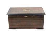 A Swiss Cylinder Music Box, Height 8 1/2 x width 19 1/2 x depth 11 inches.