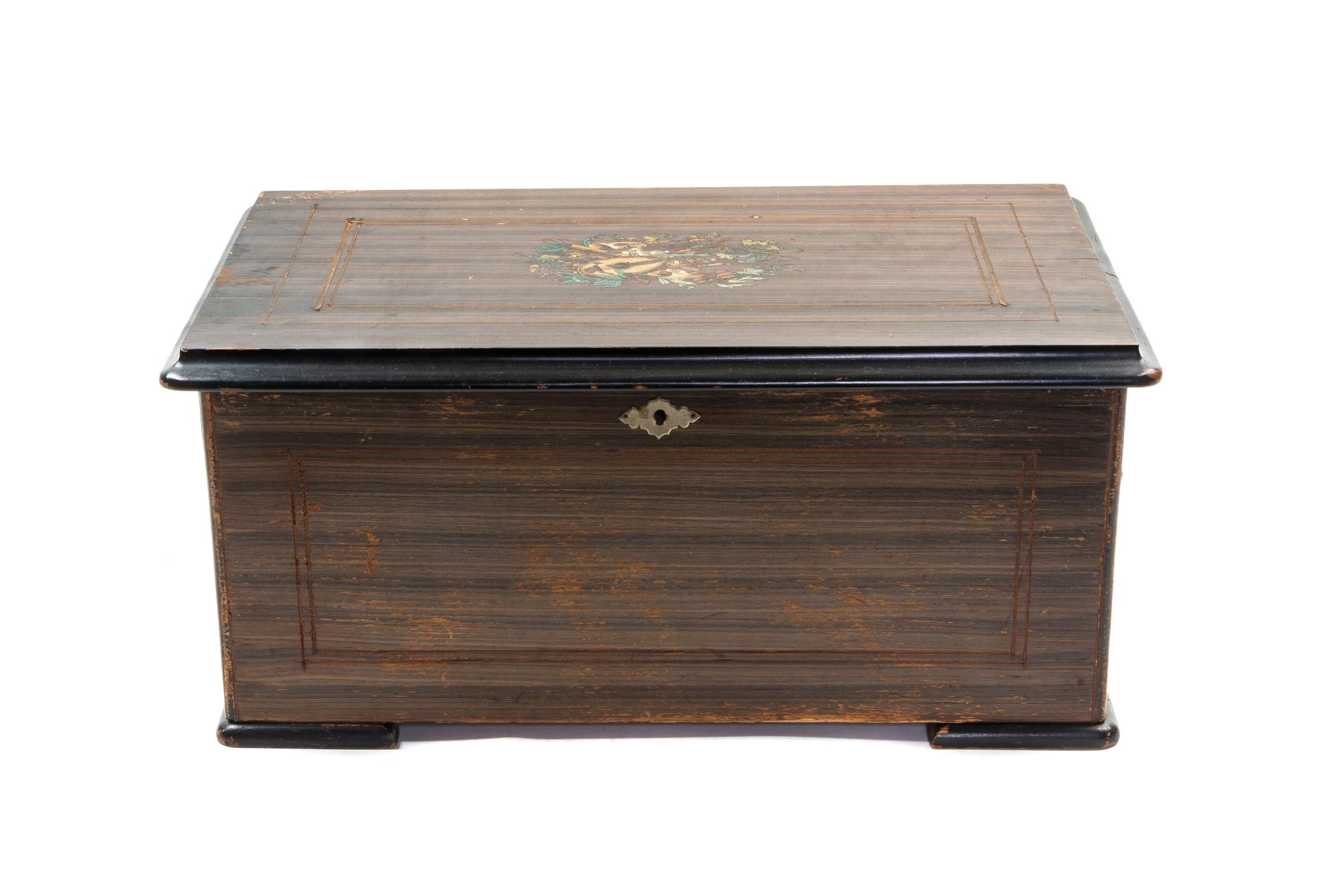 A Swiss Cylinder Music Box, Height 8 1/2 x width 19 1/2 x depth 11 inches.