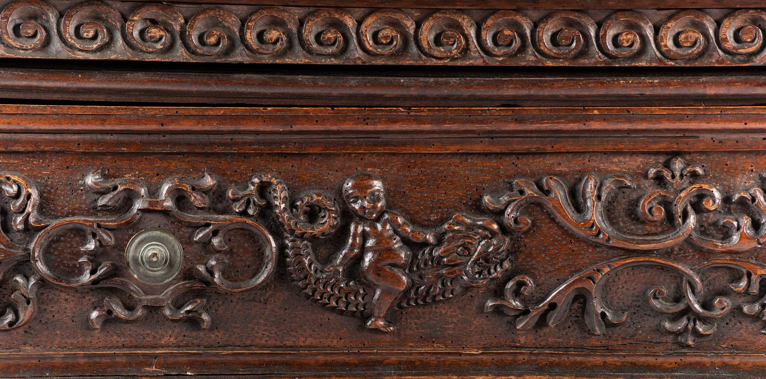 A Baroque Highly Carved Walnut Commode