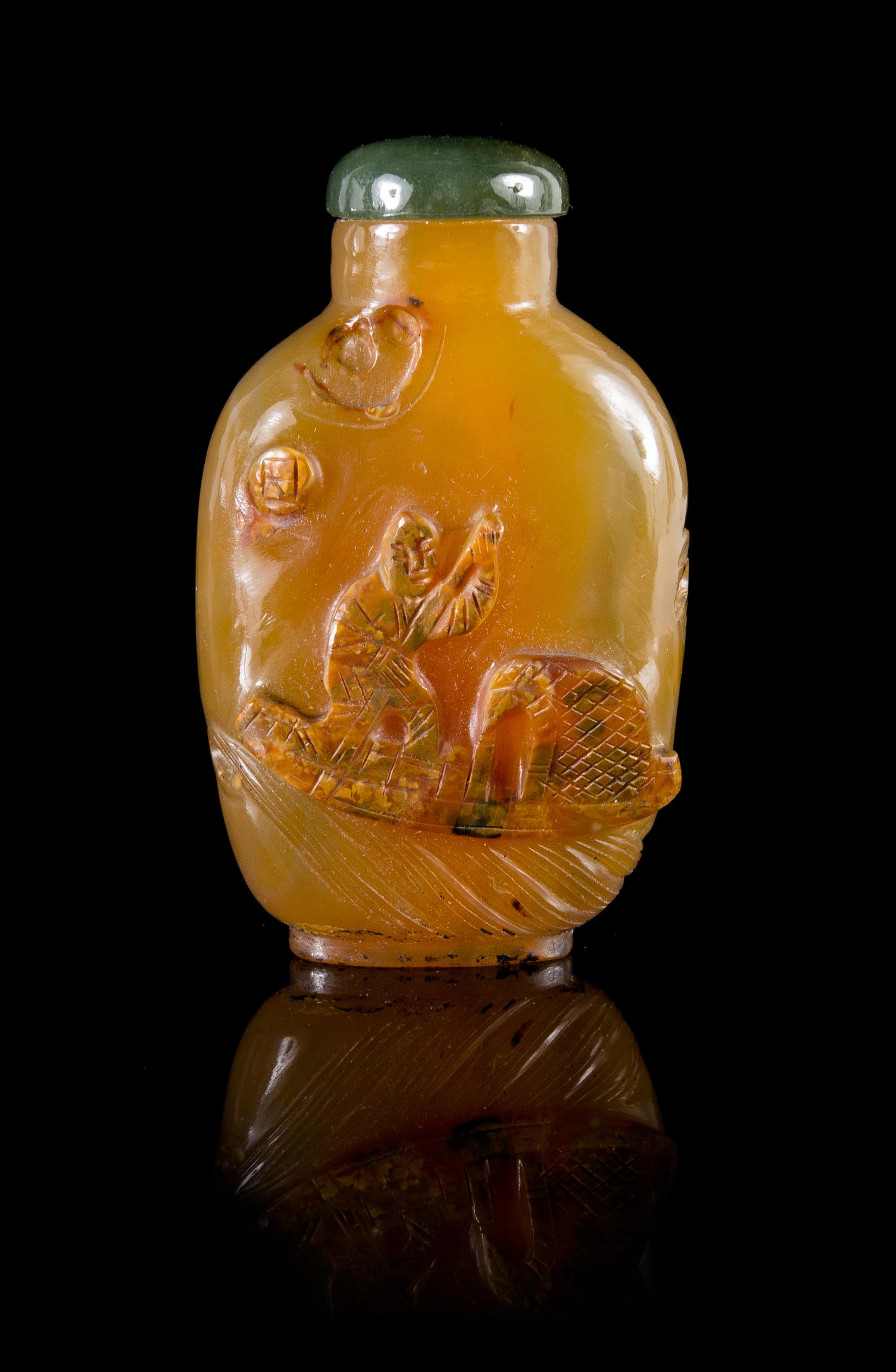 A Carved Shadow Agate Snuff Bottle Height 2 3/4 inches.