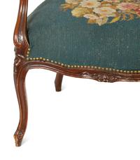 A Pair of Louis XV Style Walnut Fauteuils