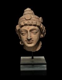 A Small Gandharan Polychromed Stucco Head of a Bodhisattva