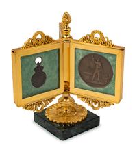 An Empire Style Gilt Bronze Tripartite Frame on Stand