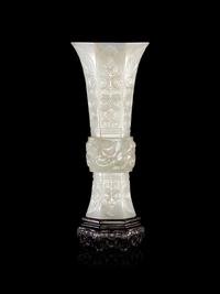 A Carved White Jade Gu Vase