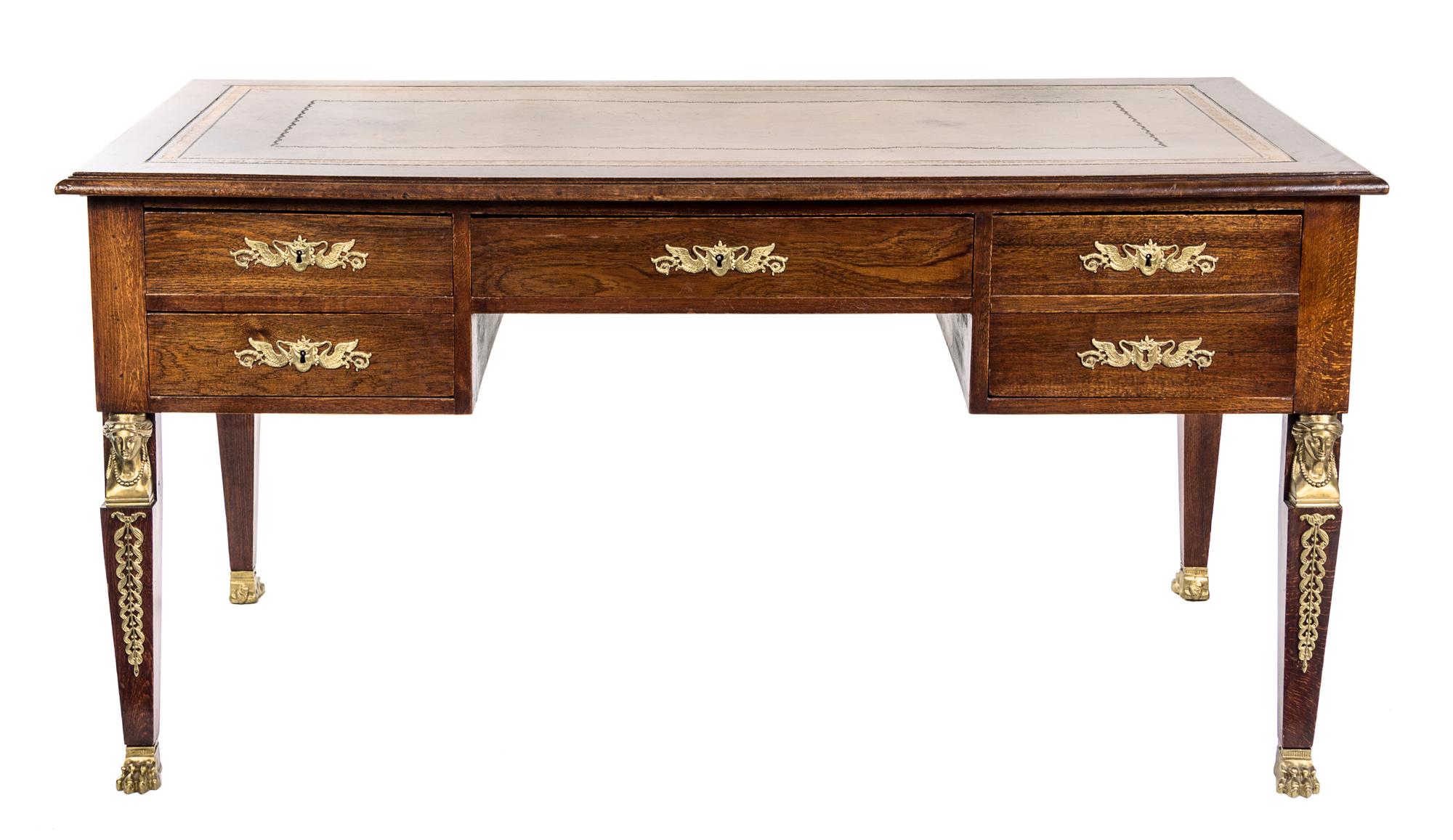 An Empire Style Gilt Bronze Mounted Oak Bureau Plat Height 29 1/2 x width 59 x depth 31 1/2 inches. — LATE 19TH CENTURY