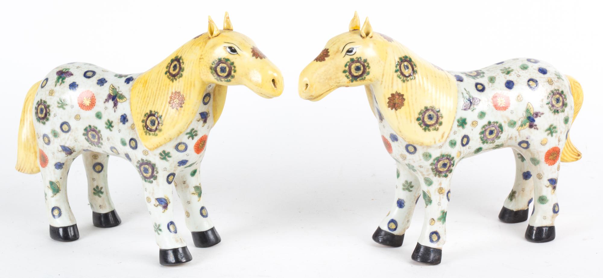 A Pair of Chinese Painted Ceramic Figures of Horses Height 10 inches.
