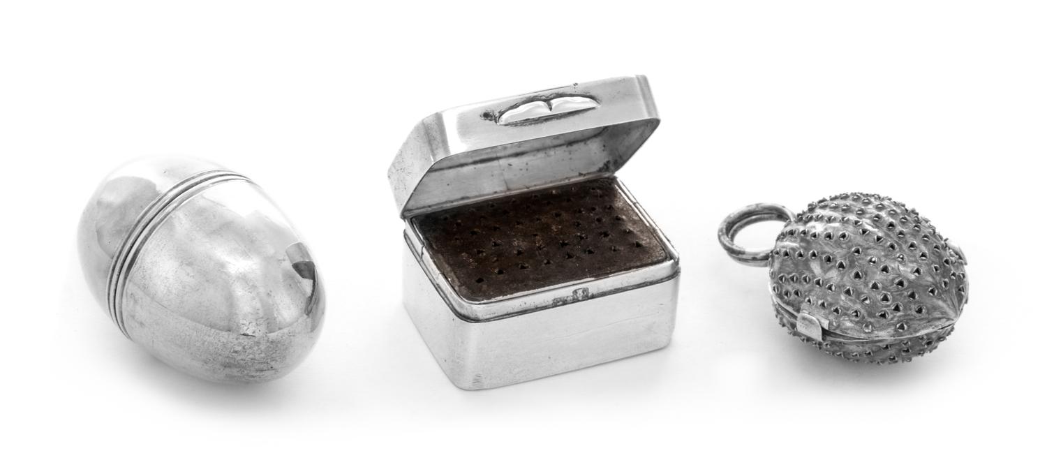 Three Silver Nutmeg Graters, , one of naturalistic form with a ring handle, one of ovoid form with a twist-off cover and one of rectang