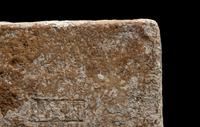 A Roman Ceramic Brick Stamped LXIII