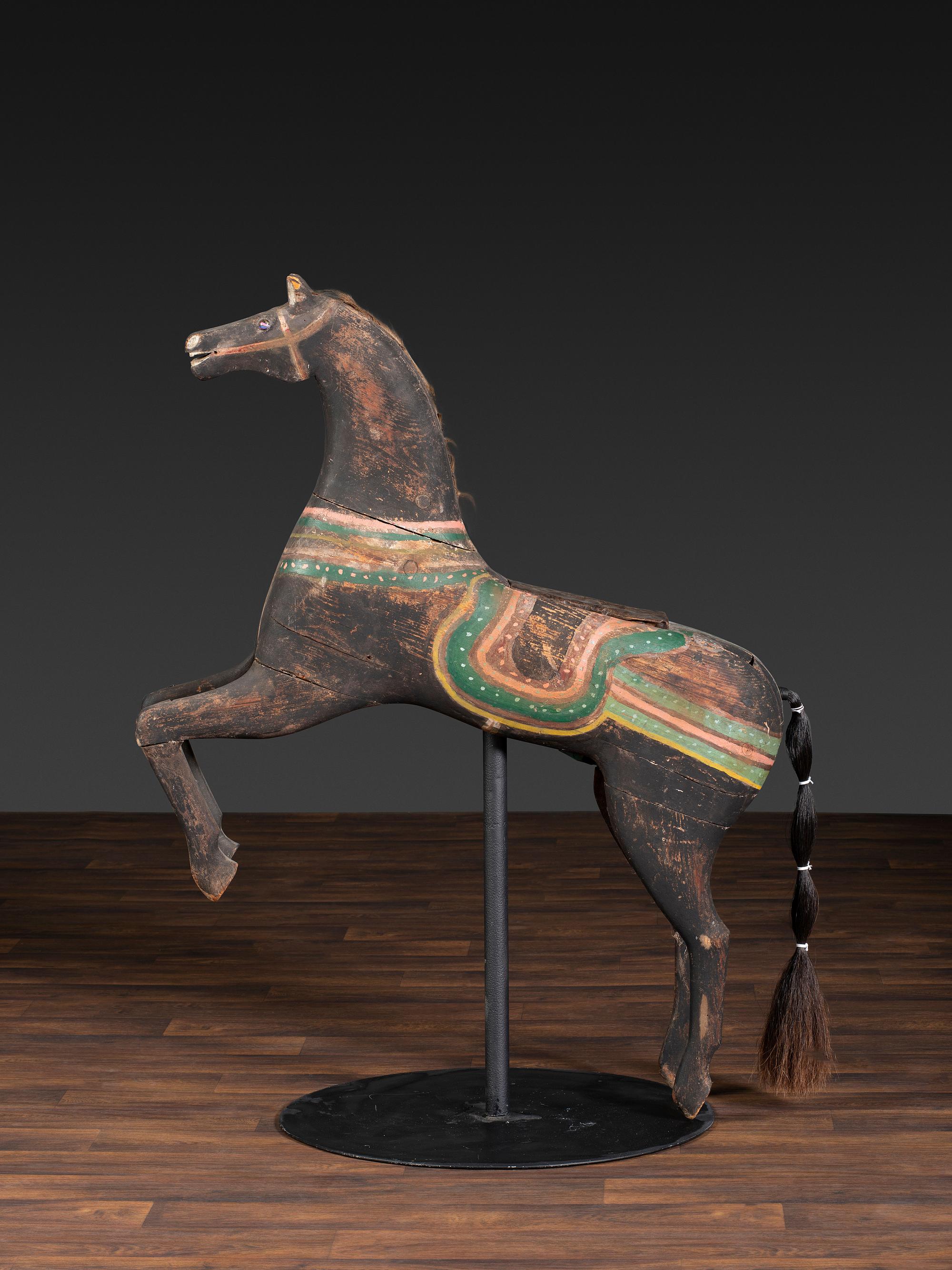 An American Glass Inset, Carved and Painted Pine Carousel Horse