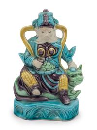A Chinese Sancai Glazed Porcelain Figure