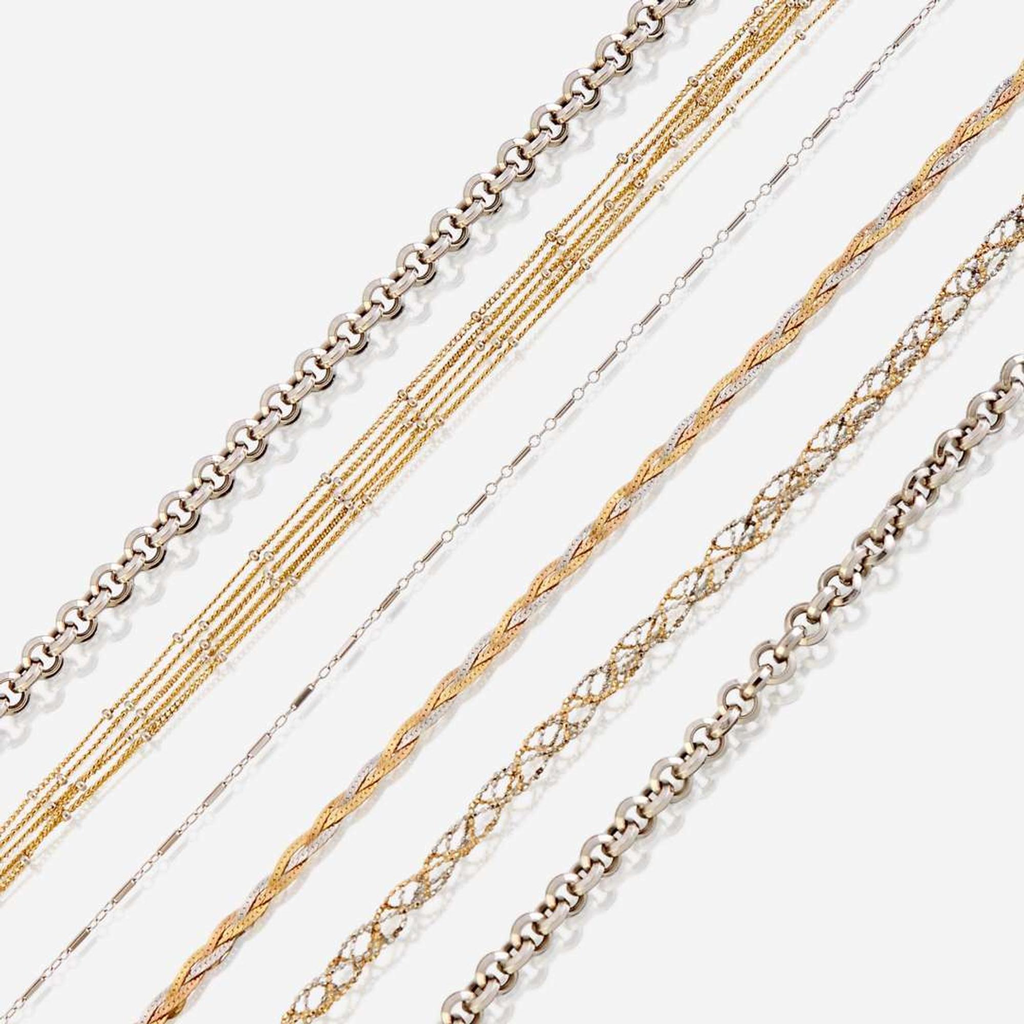 A collection of six fourteen karat gold necklaces