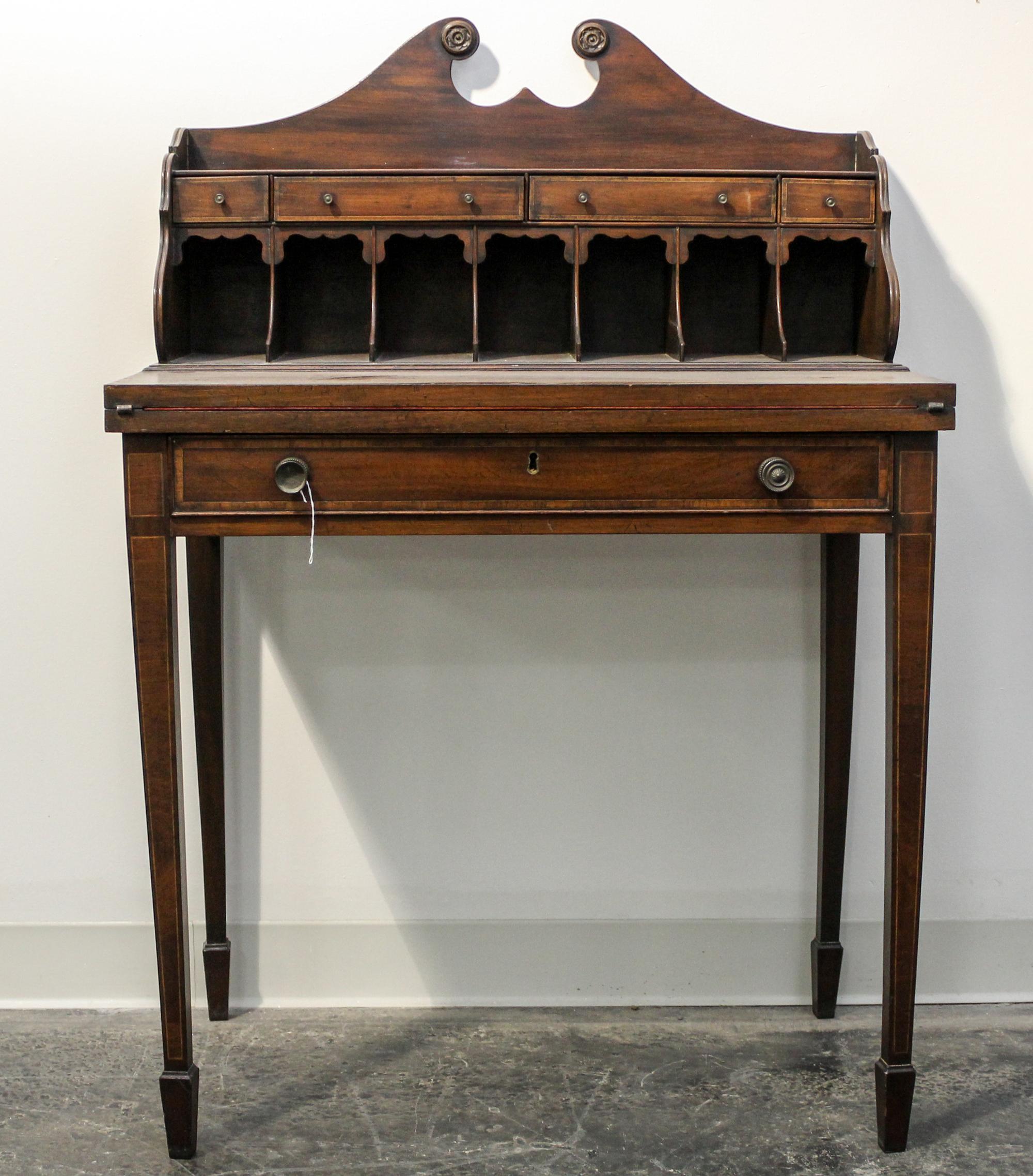 A George III Mahogany Writing Table Height 44 x width 30 x diameter 17 inches. — CIRCA 1800
