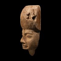 An Egyptian Wood Sarcophagus Mask