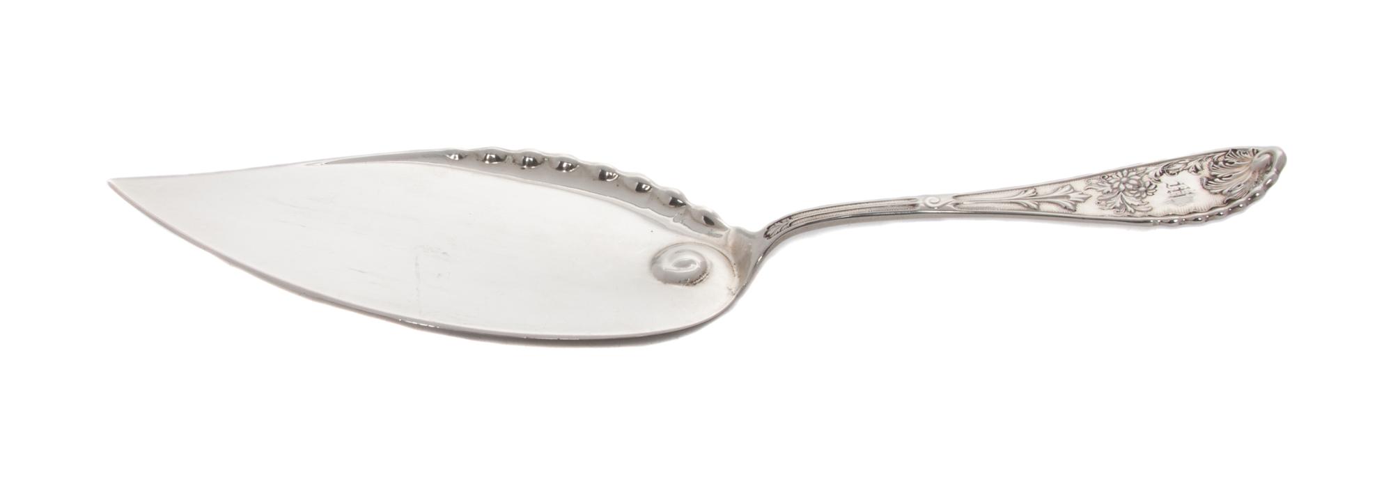 An American Silver Pie Server, Wood & Hughes, New York, NY, Late 19th Century, the rounded handle worked to show leaves, monogrammed.