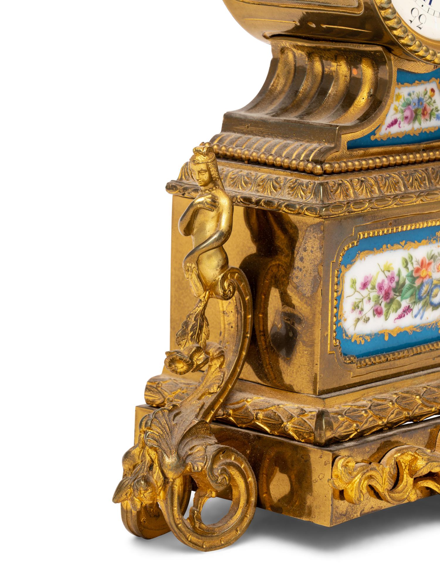 A French Gilt Metal and Porcelain Clock