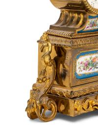 A French Gilt Metal and Porcelain Clock